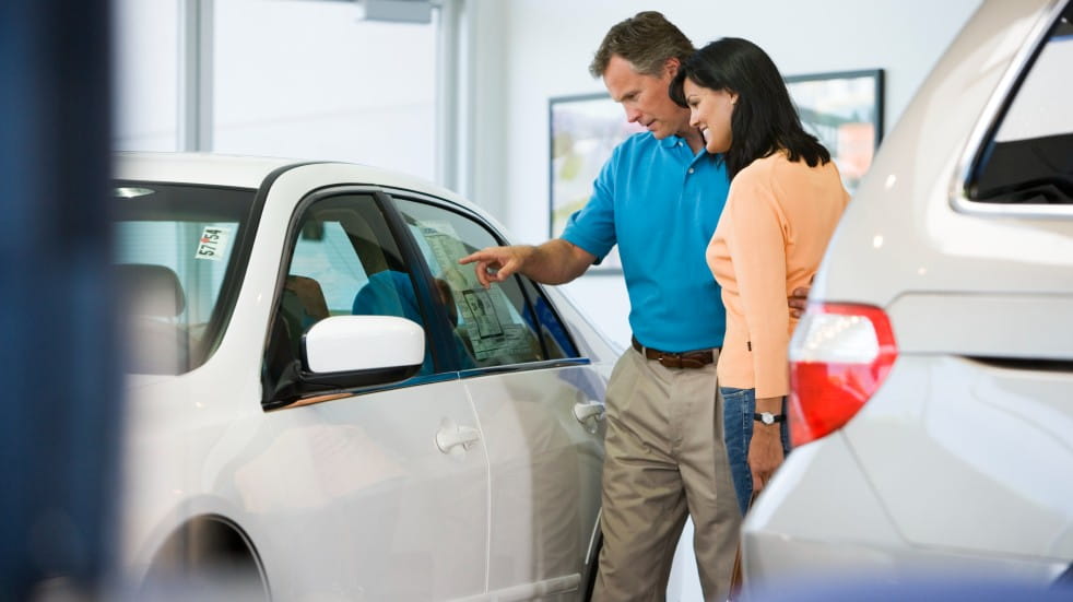 Couple looking at cars